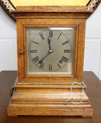 Lot 1084 - A German Oak Striking Mantel Clock, movement...