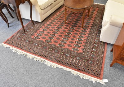 Lot 1229 - Lahore Bukhara Rug, the soft brick red field...