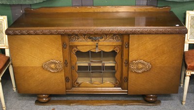 Lot 1256 - A 1920's Oak Sideboard, 163cm by 50cm by 88cm...