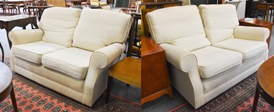 Lot 1254 - A Pair of Cream Upholstered Two-Seater Settees,...