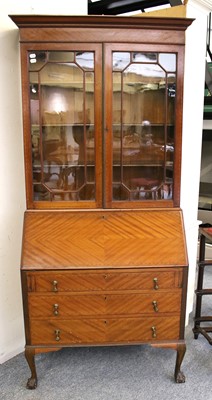 Lot 1268 - An Inlaid Bureau bookcase, 20th century, with...