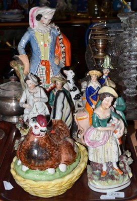 Lot 229 - Assorted Staffordshire figures including a tall figure of a Highland gentleman with gun and...