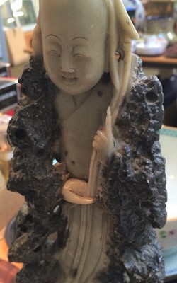 Lot 188 - A Chinese Soapstone Carving of an Immortal,...