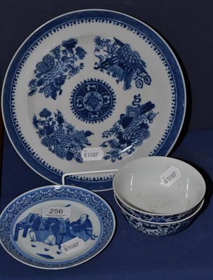 Lot 256 - A pair of blue and white bowls, decorated with flowering lilies, 11.5cm, Guangxu six character...