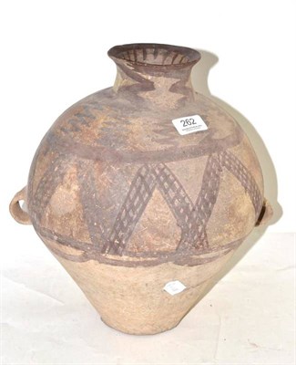 Lot 262 - A Neolithic amphora, of globular form, decorated in red with a geometric pattern, double loop...