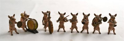 Lot 274 - Eight piece cold painted bronze pig band