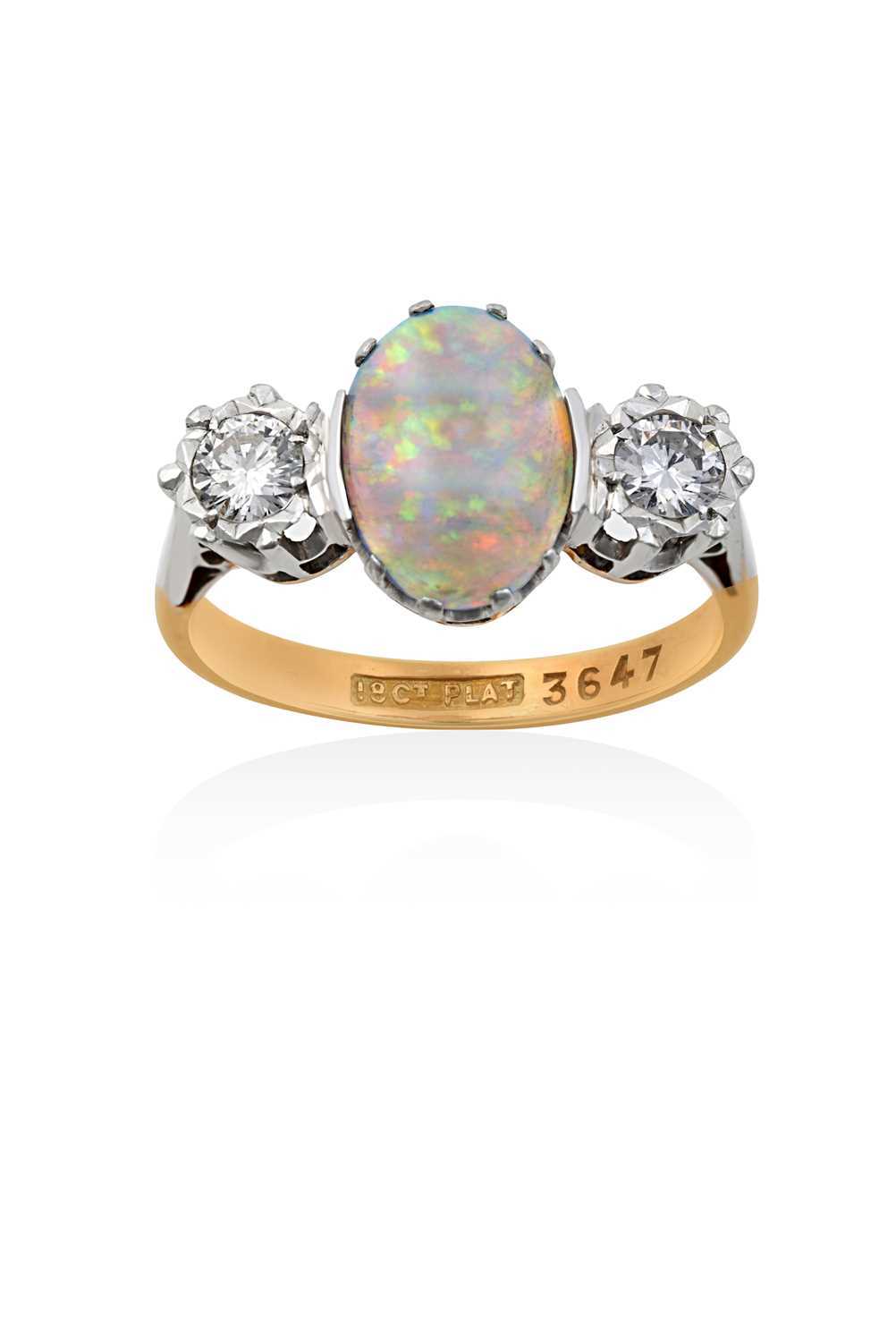 Lot 2151 - An Opal and Diamond Three Stone Ring the oval...