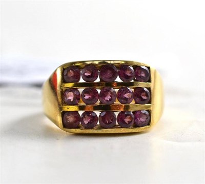 Lot 280 - A 9ct gold three row garnet ring