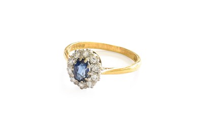 Lot 4 - An 18 Carat Gold Sapphire and Diamond Cluster...