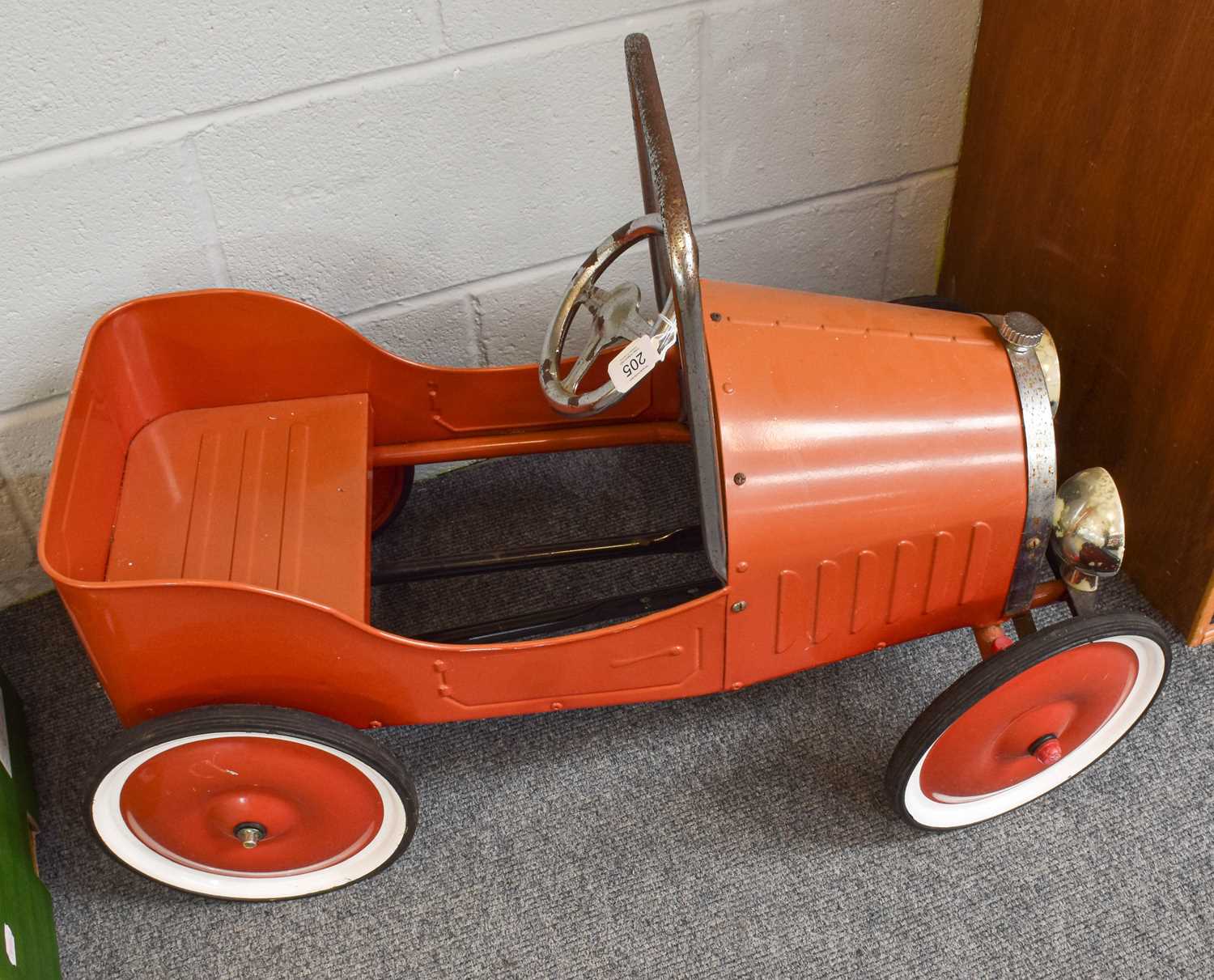 Lot 205 - A Red Pedal Car, in the form of an open topped...