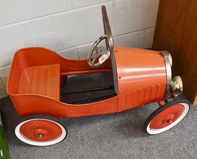 Lot 205 - A Red Pedal Car, in the form of an open topped...