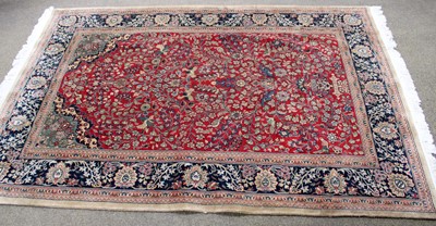 Lot 1227 - An Indo-Persian Rug, the blood field with...