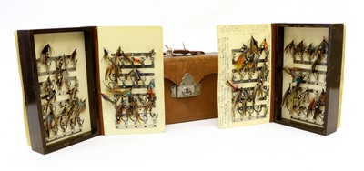 Lot 99 - An Army & Navy Leather Cased Fly Reservoir