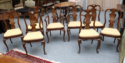 Lot 1304 - A Set of Eight Queen Anne Style Walnut Dining...