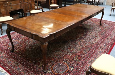 Lot 1305 - A Queen Anne Style Walnut Dining Table, with...