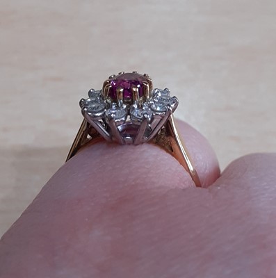 Lot 2142 - An 18 Carat Gold Ruby and Diamond Cluster Ring...
