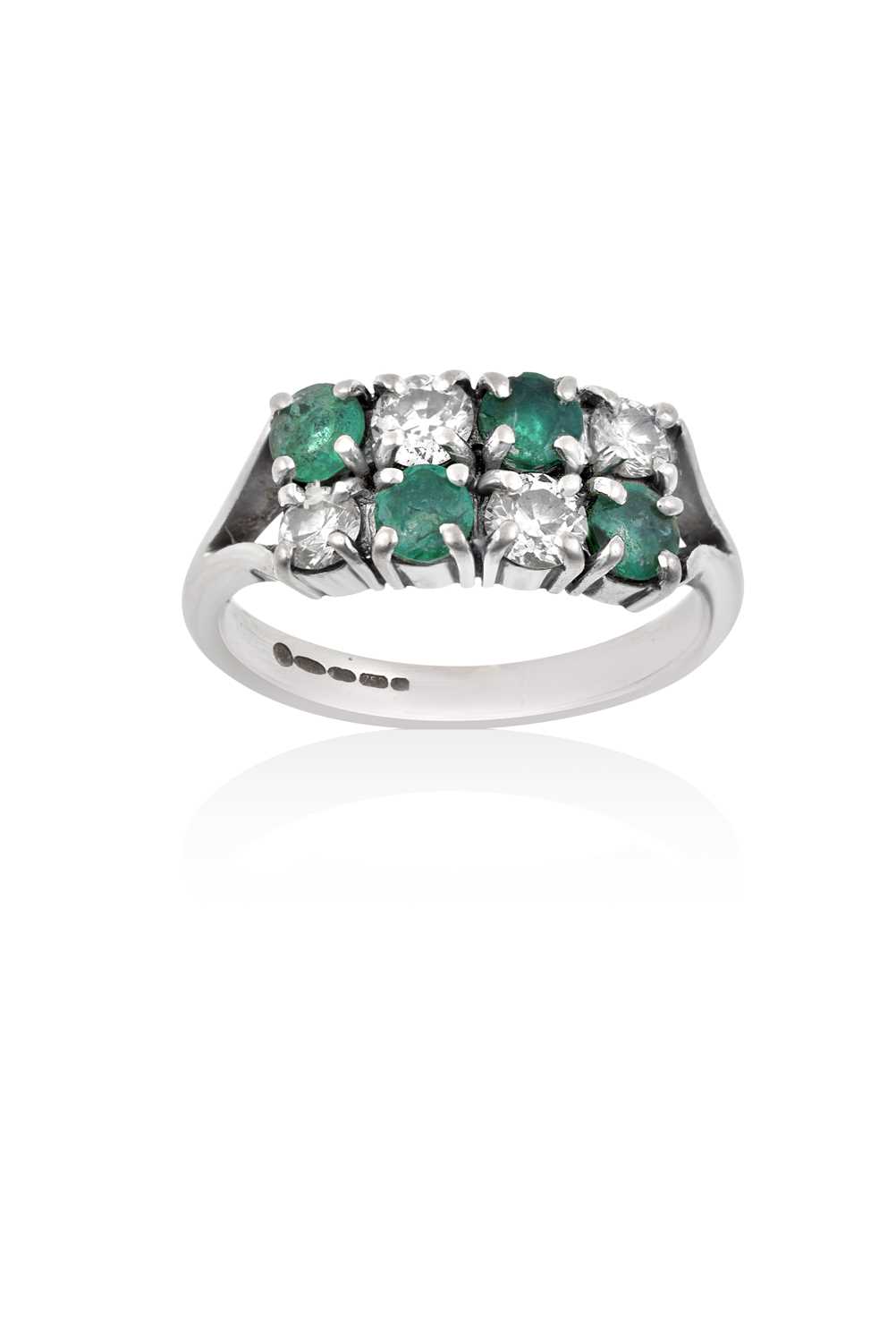 Lot 2093 - An 18 Carat White Gold Emerald and Diamond Two...