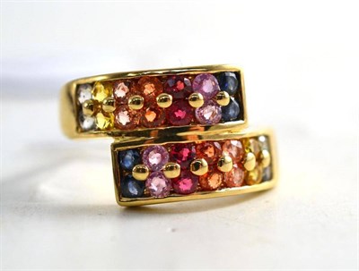 Lot 296 - A 9ct gold multi gemstone crossover ring