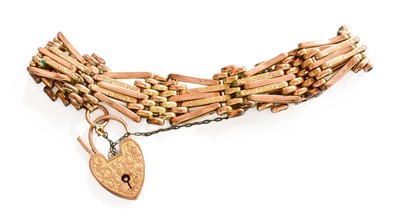 Lot 56 - A Gate Link Bracelet, with heart-shaped...