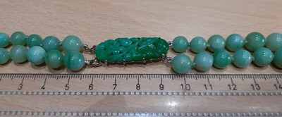 Lot 2096 - A Jade Two Row Necklace the 46:51 graduated...