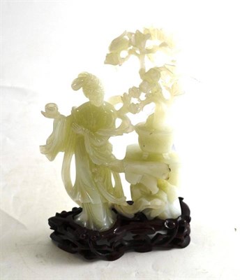 Lot 317 - A pale green stone figure with potted tree