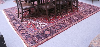 Lot 1182 - A Heriz Carpet, North West Iran, the blood red...