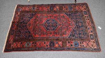 Lot 1174 - A Hamadan Rug, the strawberry lozenge field...