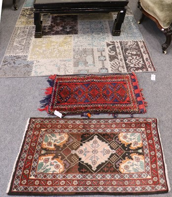 Lot 1176 - A Machine Made Patchwork Rug, together with...