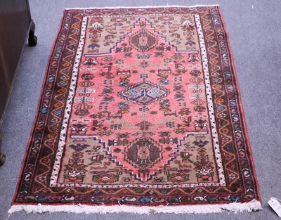 Lot 1186 - A Kashqui Rug, the faded madder field centered...