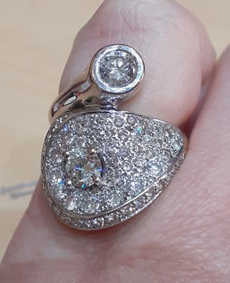 Lot 2026 - An 18 Carat White Gold Diamond Crossover Ring...