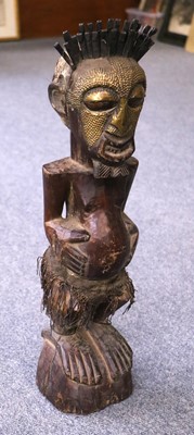 Lot 196 - A West African Carned Harwood Tribal...