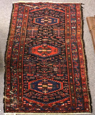 Lot 1177 - A West Persian Village Rug, with a deep...