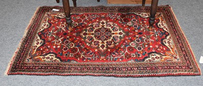 Lot 1179 - A Hamadan Rug, with a raspberry field of...