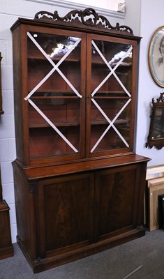 Lot 1192 - A George III Mahogany Bookcase, the glazed...