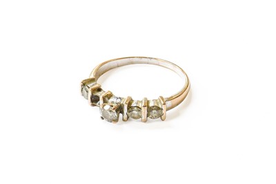 Lot 105 - A Diamond Five Stone Ring, the central raised...