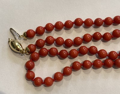 Lot 102 - A Coral Necklace, clasp stamped '750', length...