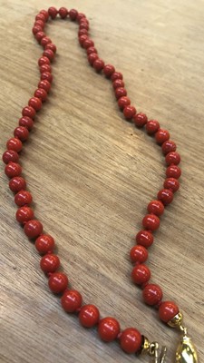 Lot 102 - A Coral Necklace, clasp stamped '750', length...