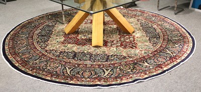 Lot 1016 - An Indian Roundal Carpet, the indigo ivory and...