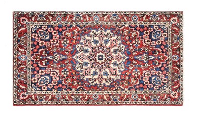 Lot 622 - Bakhtiari Rug West Iran, circa 1950 The maroon...