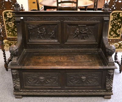 Lot 1133 - A Carved Oak Box Settle, early 20th century,...