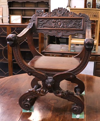 Lot 1233 - A 20th Century Carved Oak Savonarola Style Chair