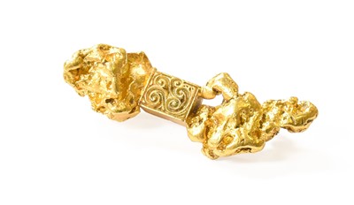 Lot 112 - A Nugget Brooch, the central rectangular...