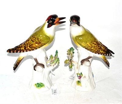 Lot 112 - A Pair of Meissen Porcelain Figures of Green Woodpeckers, 20th century, each perched on a tree...