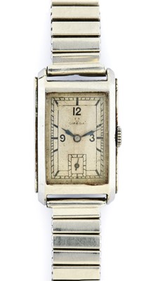 Lot 164 - Omega: A Stainless Steel Curved Rectangular...