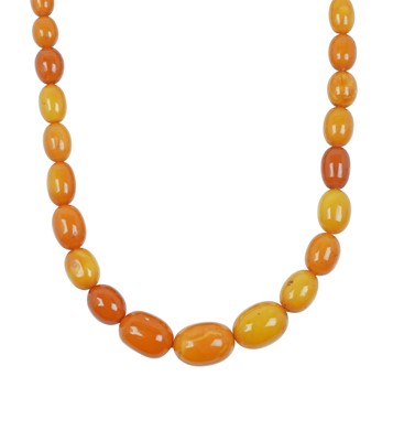 Lot 2088 - An Amber Bead Necklace comprising of...
