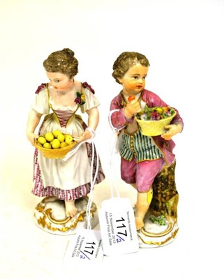Lot 117 - A Pair of Meissen Porcelain Figures of Fruit Sellers, circa 1760, as a boy and girl standing...