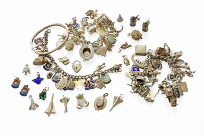Lot 246 - Three Silver Charm Bracelets, hung with...