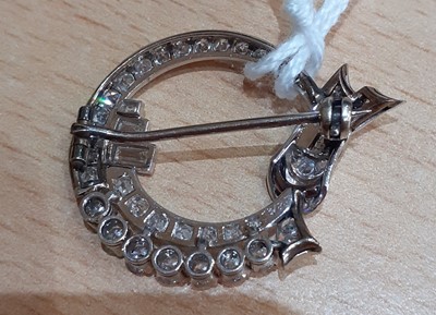 Lot 2091 - A Diamond Brooch the ribbon tied circular...