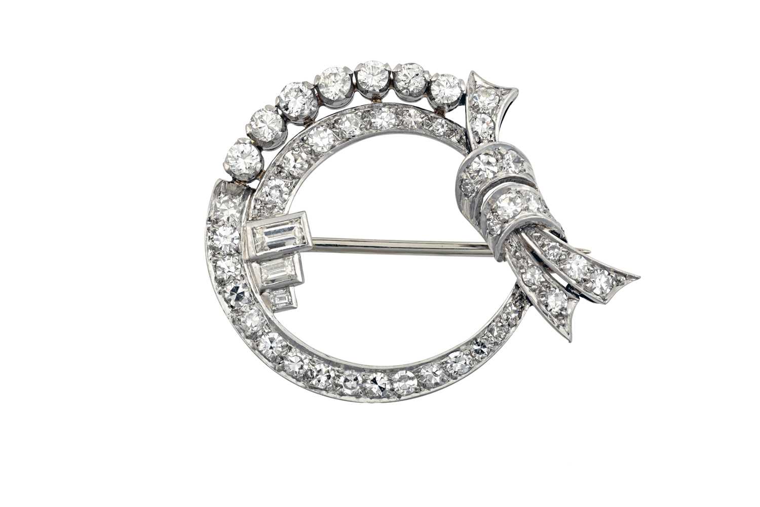 Lot 2091 - A Diamond Brooch the ribbon tied circular...