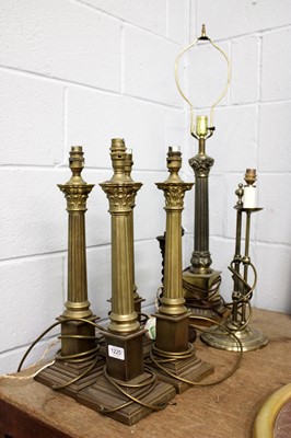 Lot 1225 - A Set of Four Corinthian Columnar Brass Table...